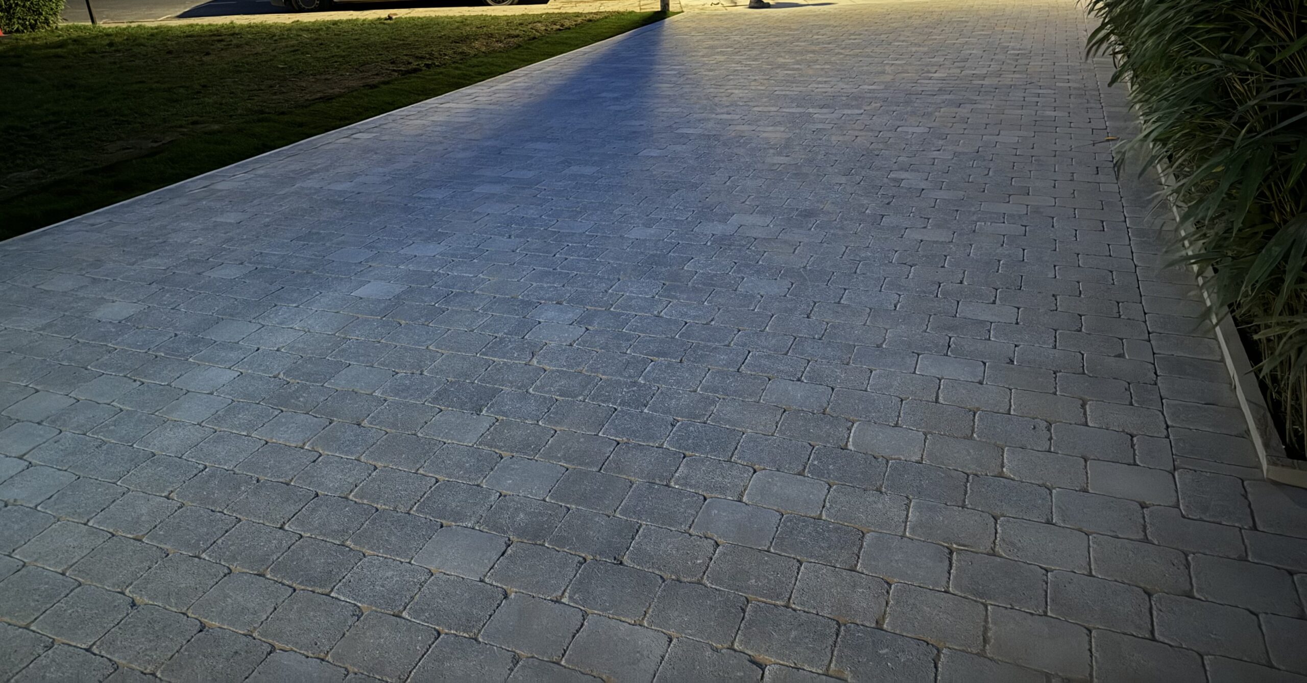 Professional driveway paving service with traditional brick design